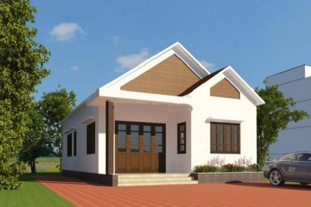 Mẫu thiết kế nhà cấp 4 với mái thái mang hơi hướng hiện đại cùng sự kết hợp của gam màu trắng nhẹ nhàng đan xen với những khung cửa gỗ mộc mạc tạo nên sự hài hoà cho căn nhà.